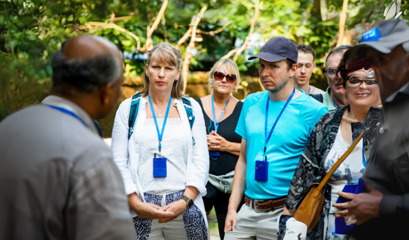 tour guide the people in image